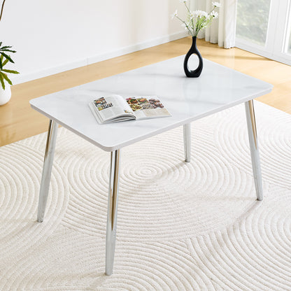 Modern minimalist rectangular dining table, suitable for 4-6 people. Tempered glass countertop+lower MDF board,imitation marble texture, silver metal tapered legs. Suitable for minimalist restaurants.