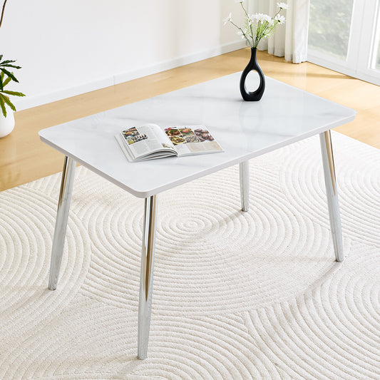 Modern minimalist rectangular dining table, suitable for 4-6 people. Tempered glass countertop+lower MDF board,imitation marble texture, silver metal tapered legs. Suitable for minimalist restaurants.